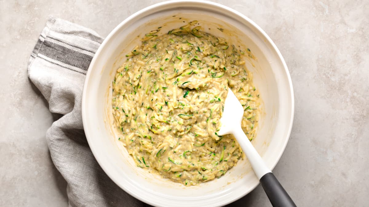 Mix the batter for the savory zucchini muffins