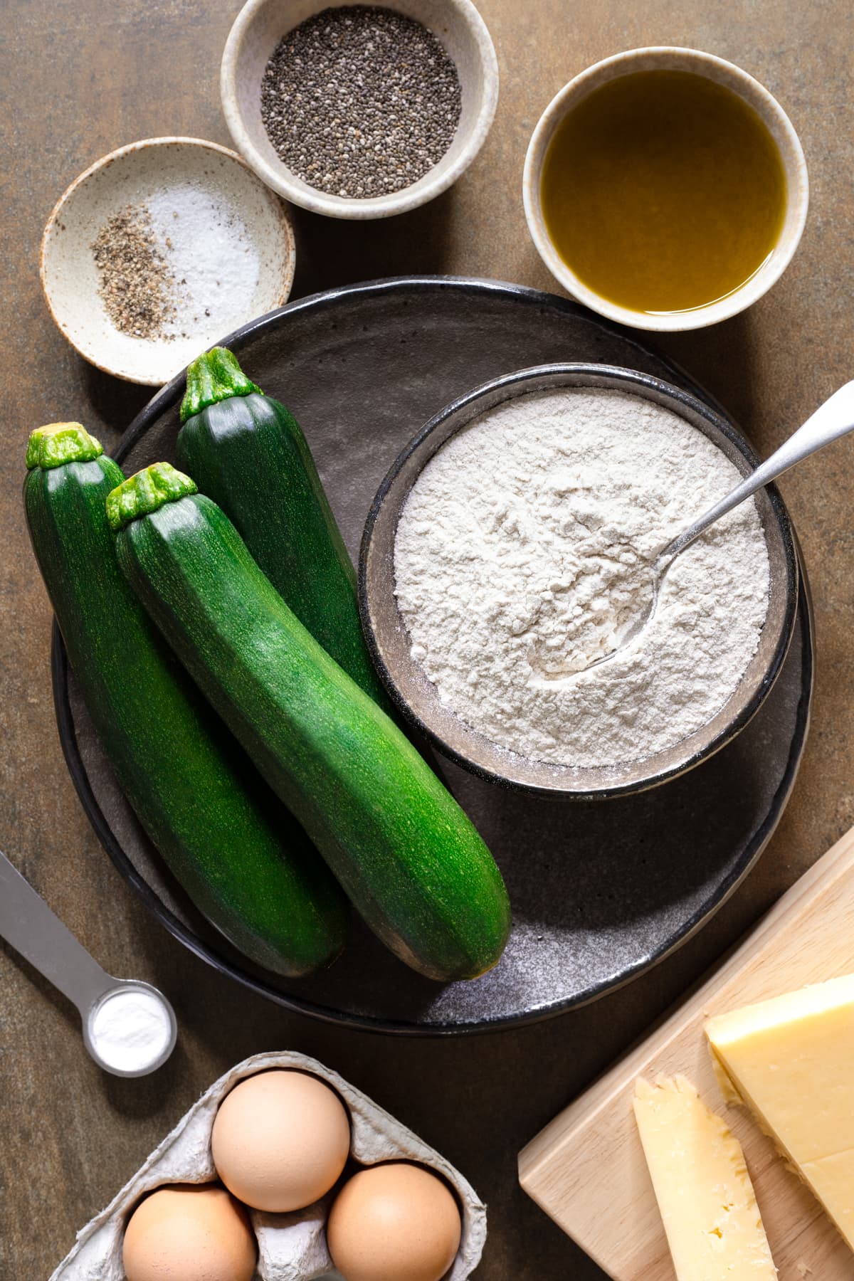 Ingredients for buckwheat zucchini muffins laid out on a table