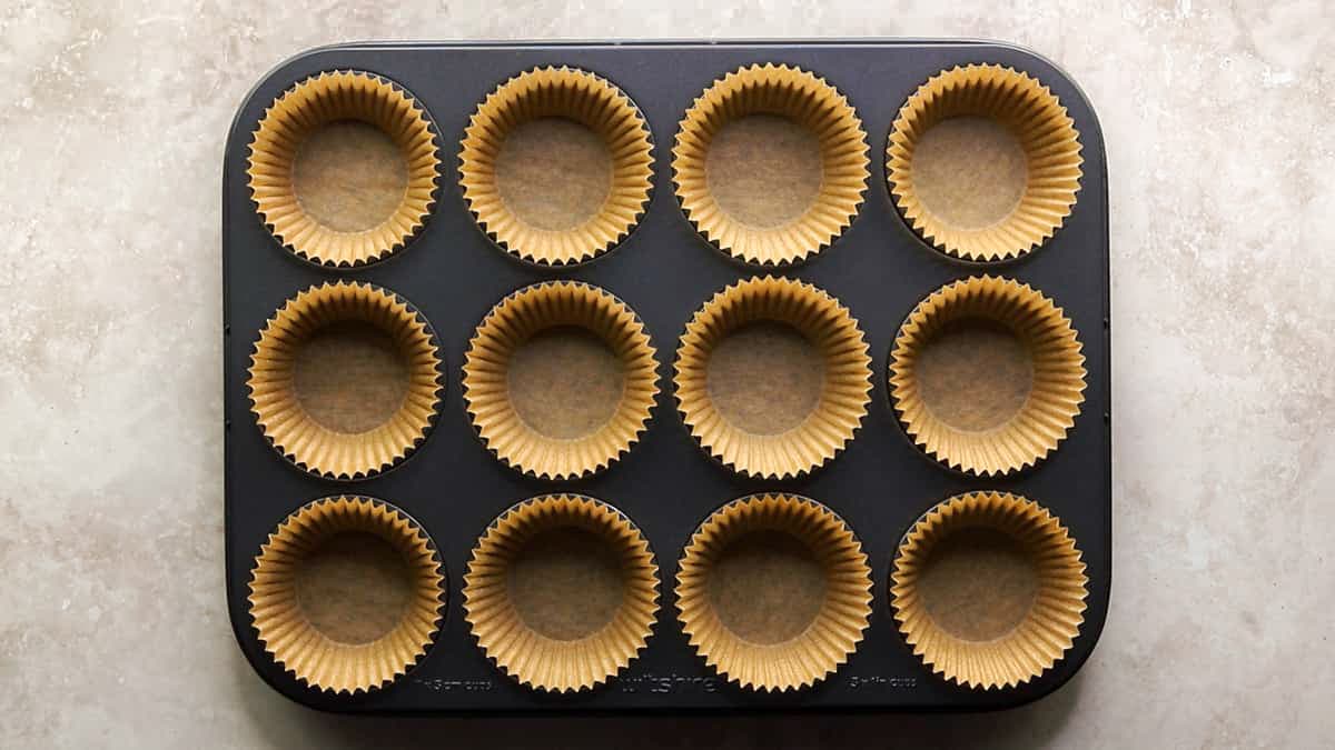 Line a muffin tray with paper cases