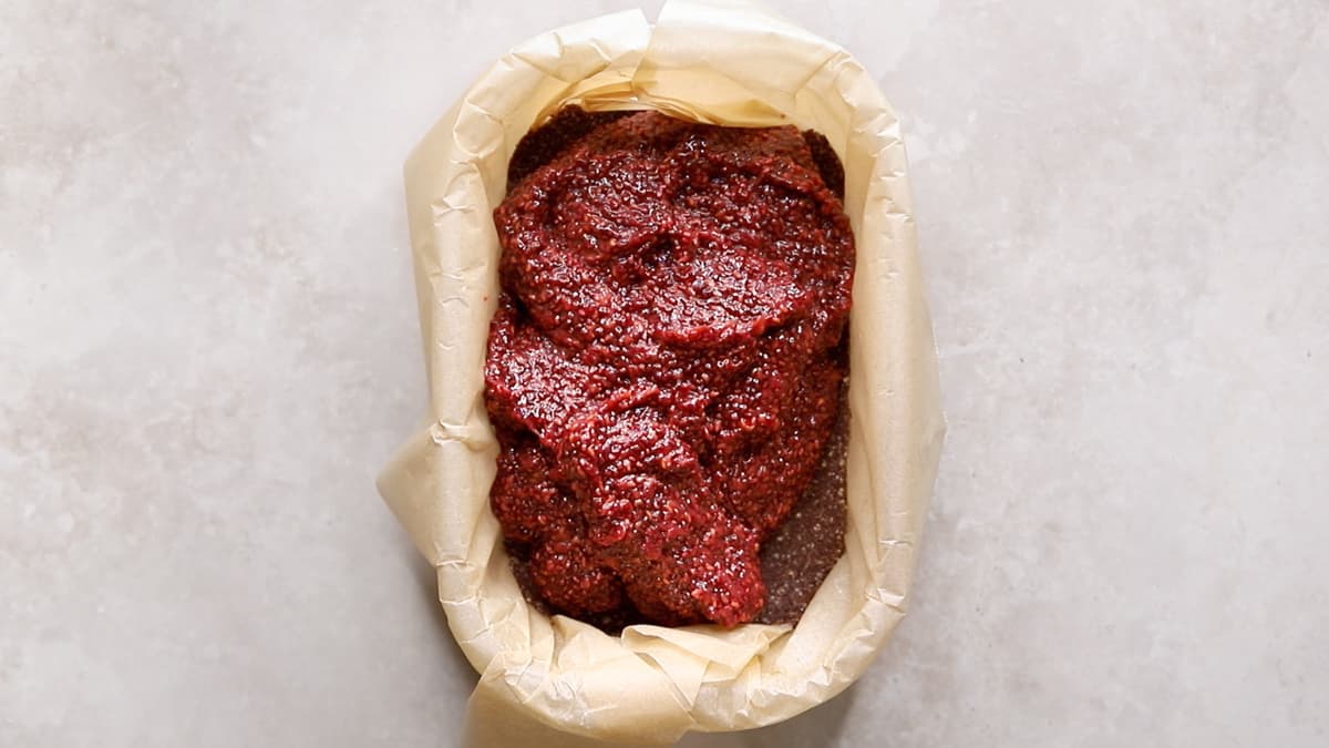 Raspberry chia jam filling in a container