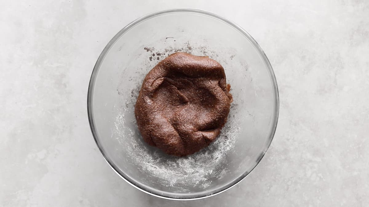 Chocolate protein bar dough mixed in a bowl