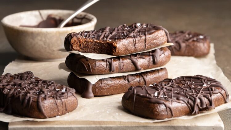 No-bake chocolate whey protein bars with a bite taken out of one bar