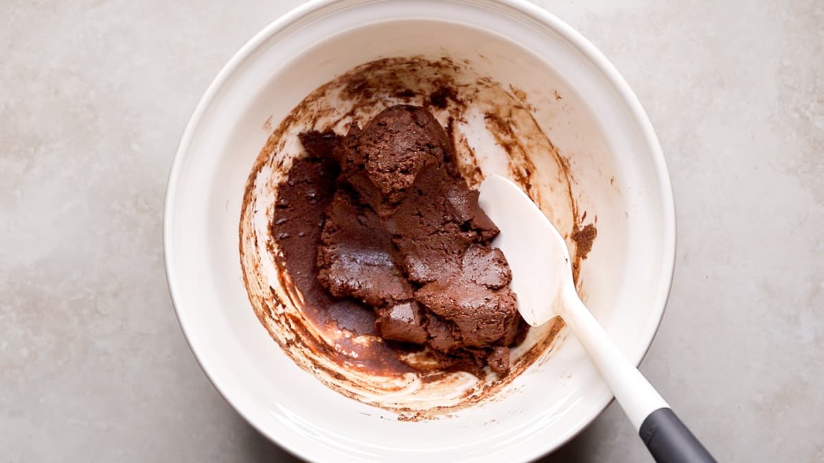 Bowl of choc mint protein dough being mixed with a spatula