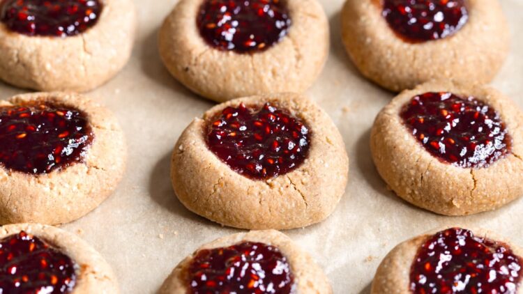 Buckwheat jam thumbprint cookies with one cookie broken in half