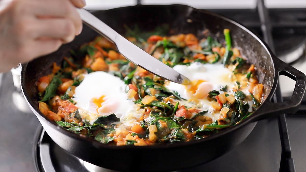 Cook the eggs for the shakshuka to your liking