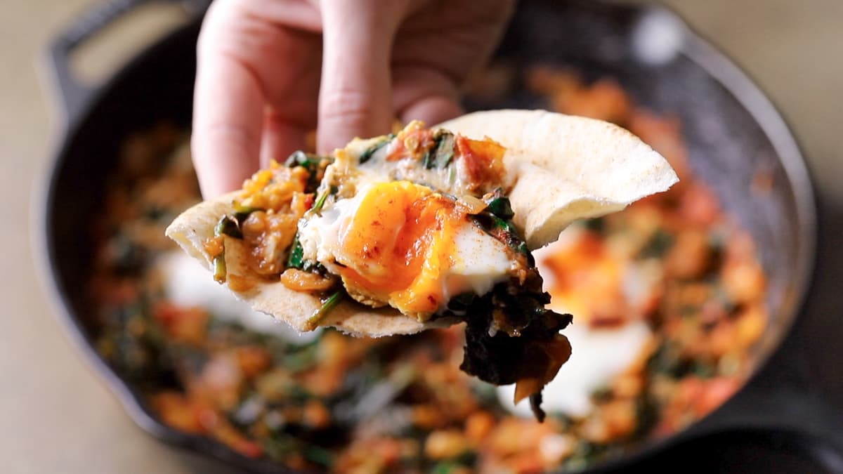 Serve the shakshuka with extra smoked paprika and flatbread