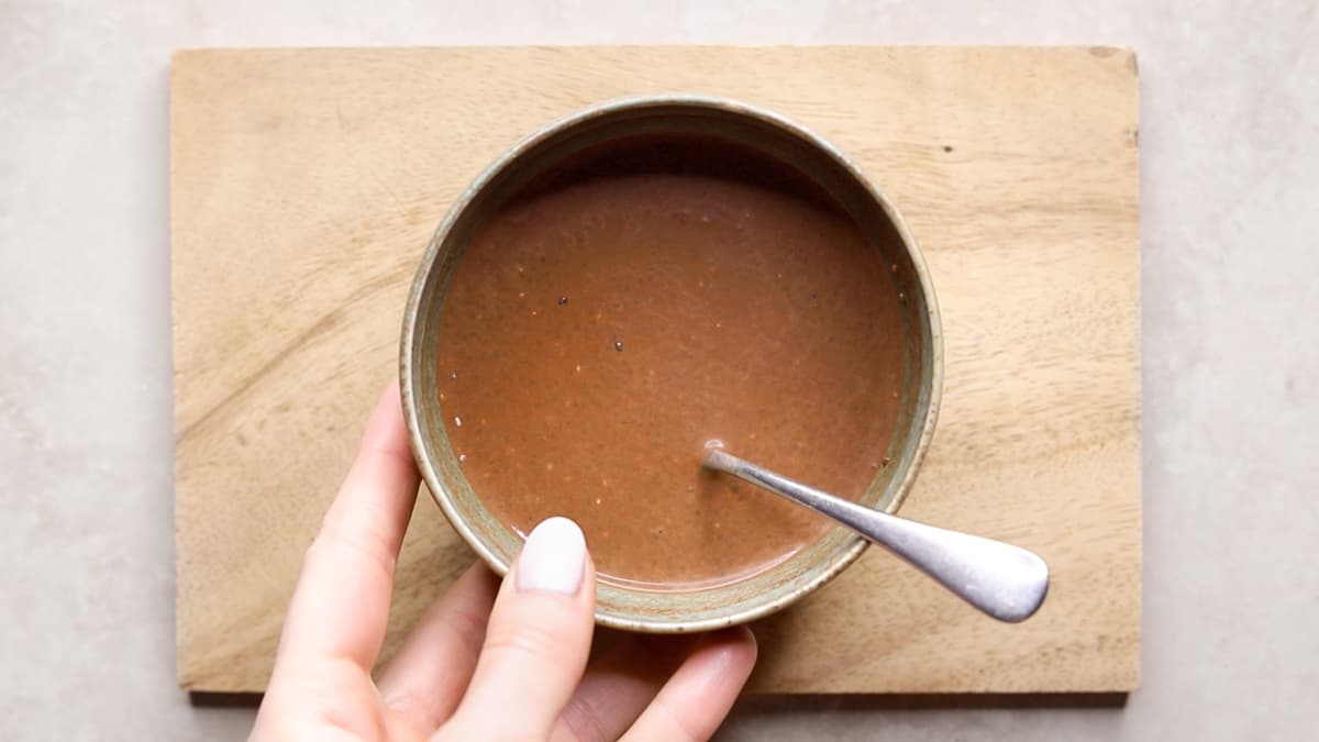 Small bowl with a mix of chia seeds, raw cacao powder, and almond milk