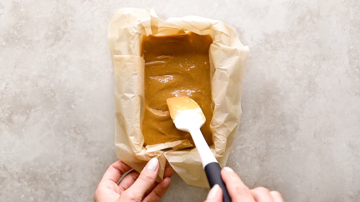 Smooth the caramel filling mixture over the base