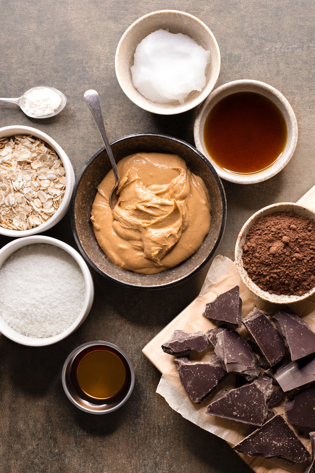 Ingredients for easy no-bake vegan slice laid out in bowls