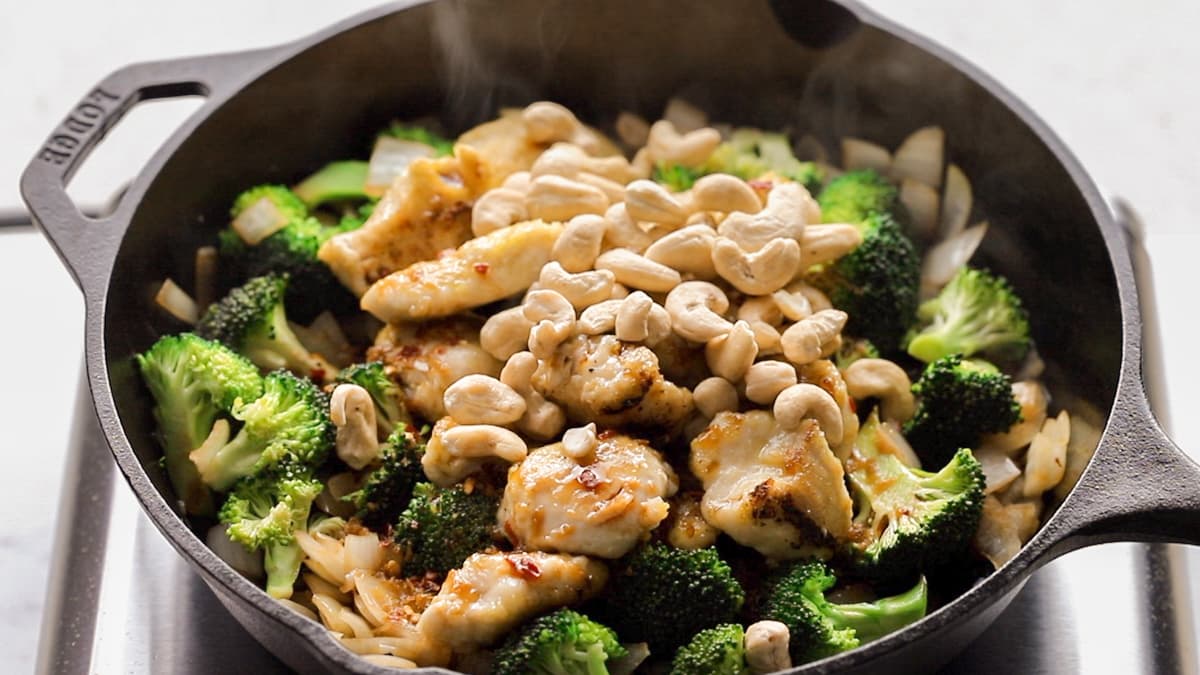 Add the sauce and cashew nuts and cook until the stir fry sauce thickens