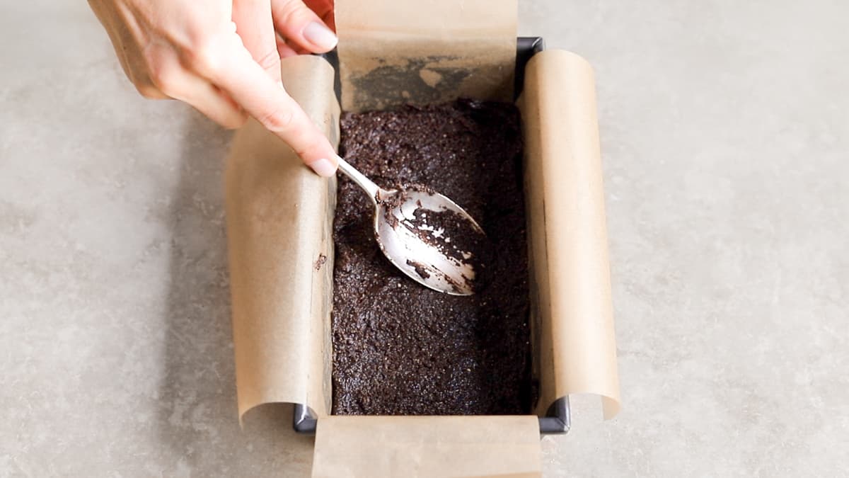 Press the base into the lined tin