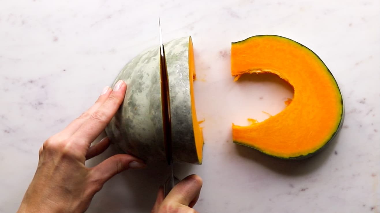 Cutting pumpkin into wedges