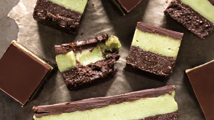 Vegan no-bake chocolate mint slice with a bite taken out of one piece
