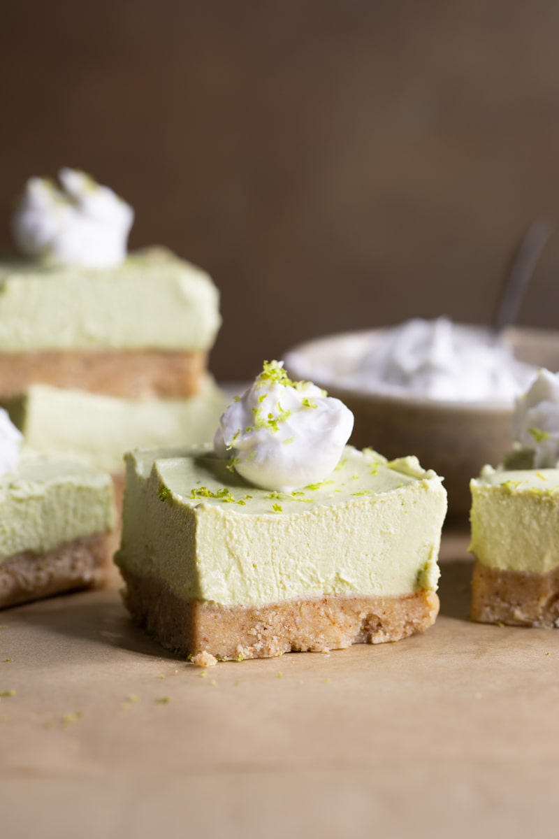 No Bake Vegan Lime Cheesecake topped with coconut cream
