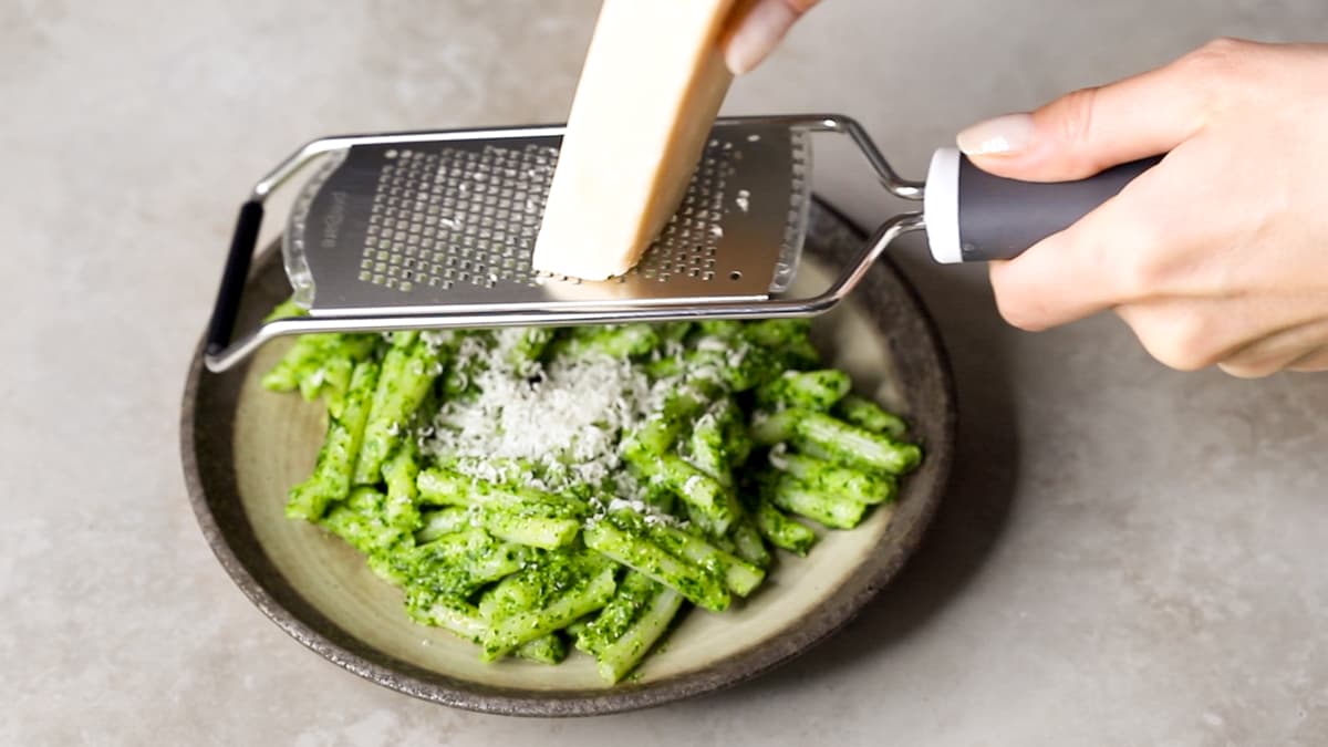 Serve the pesto pasta with an extra grating of Parmesan cheese