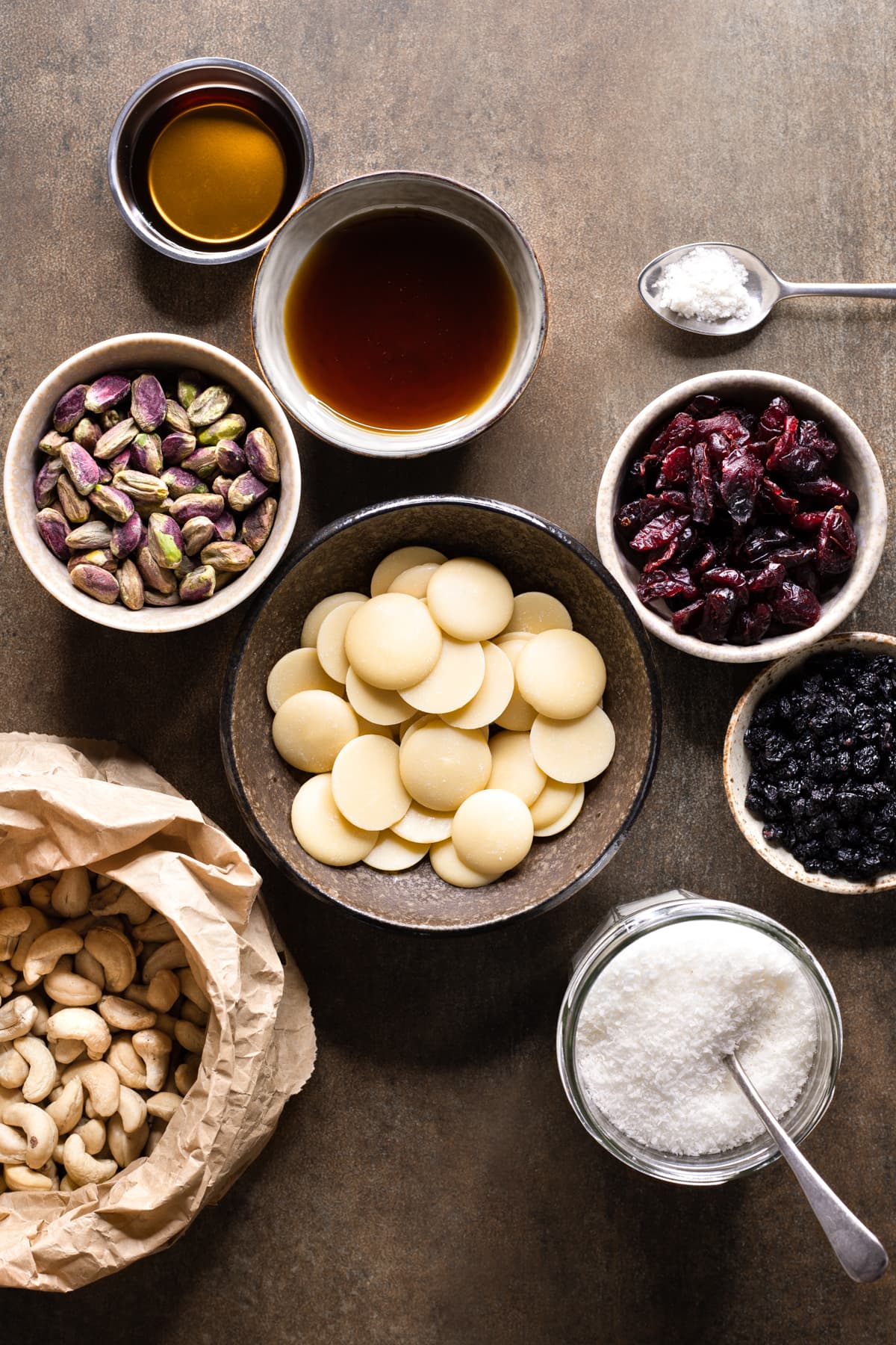 Ingredients for vegan white christmas slice set out in bowls