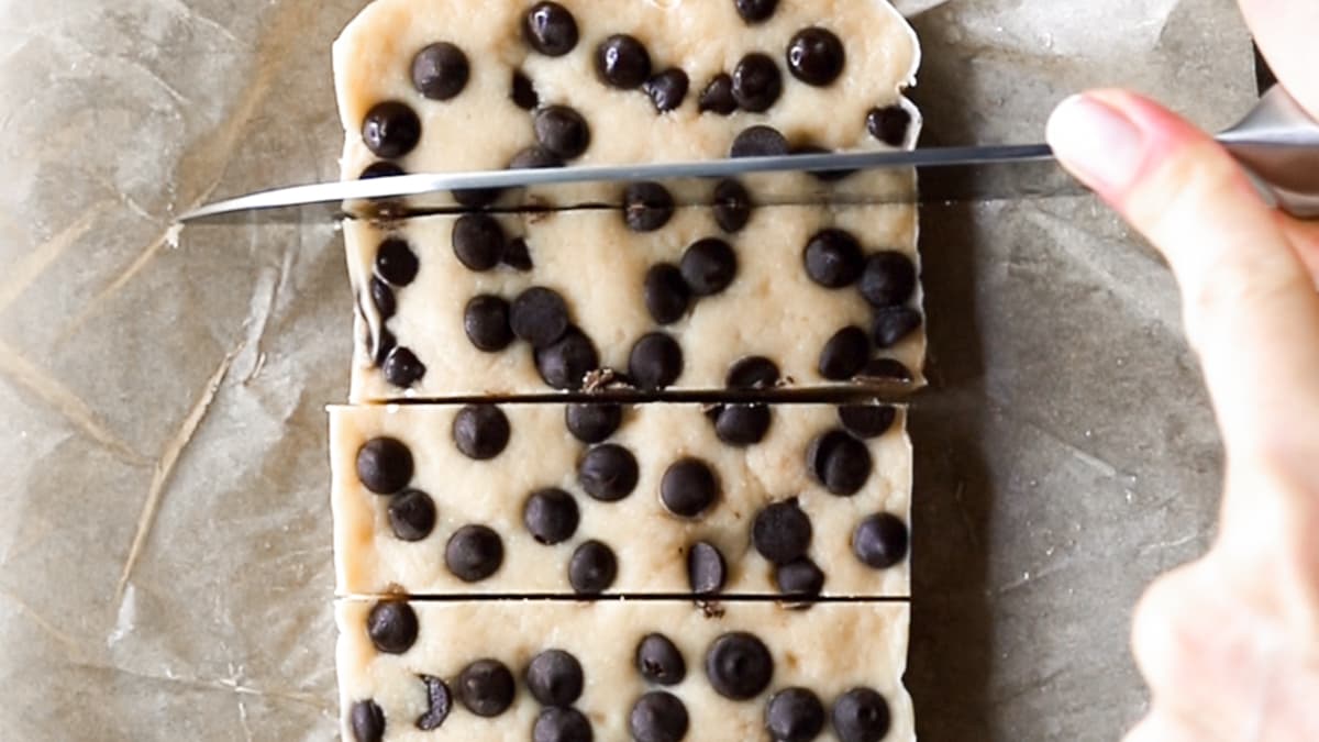 Chilled nut-free cookie dough protein bars cut into rectangular pieces, ready to serve