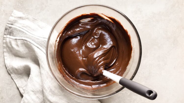 Vegan avocado chocolate frosting in a glass bowl