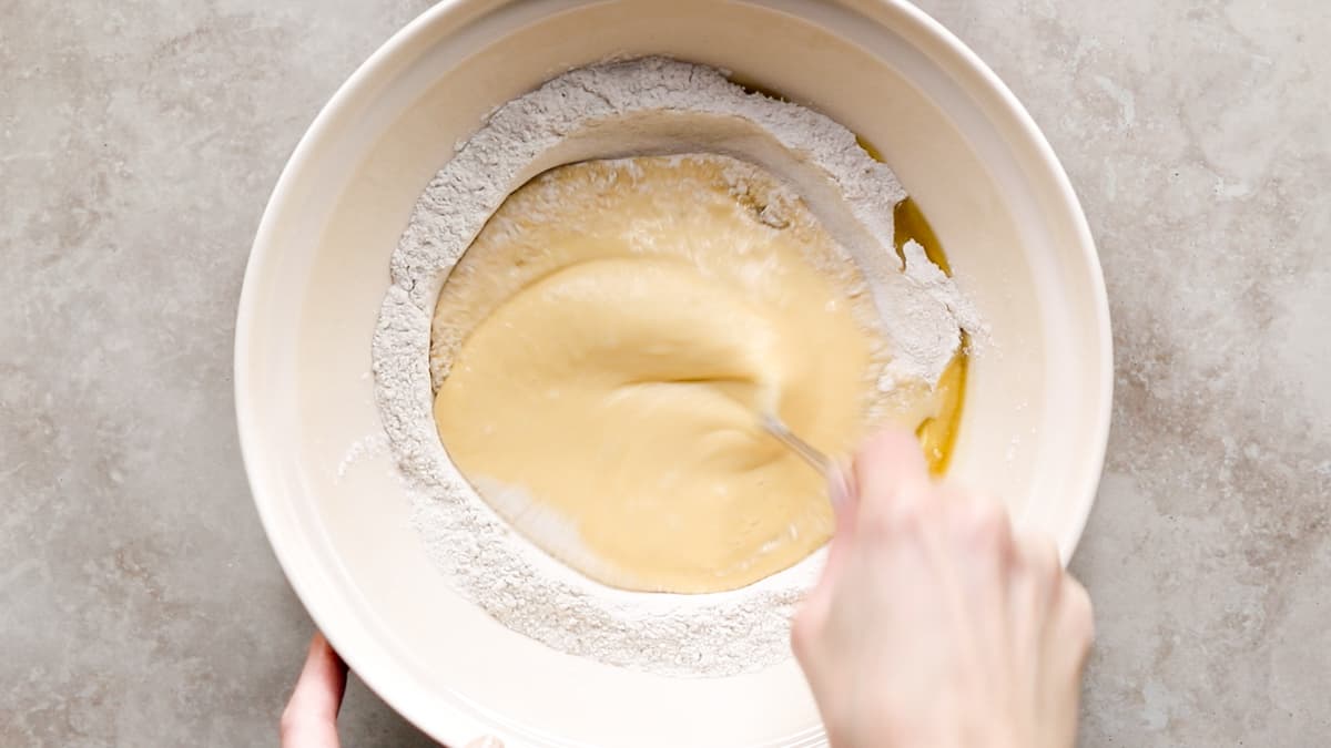 Mix the wet and dry ingredients for the buckwheat bread