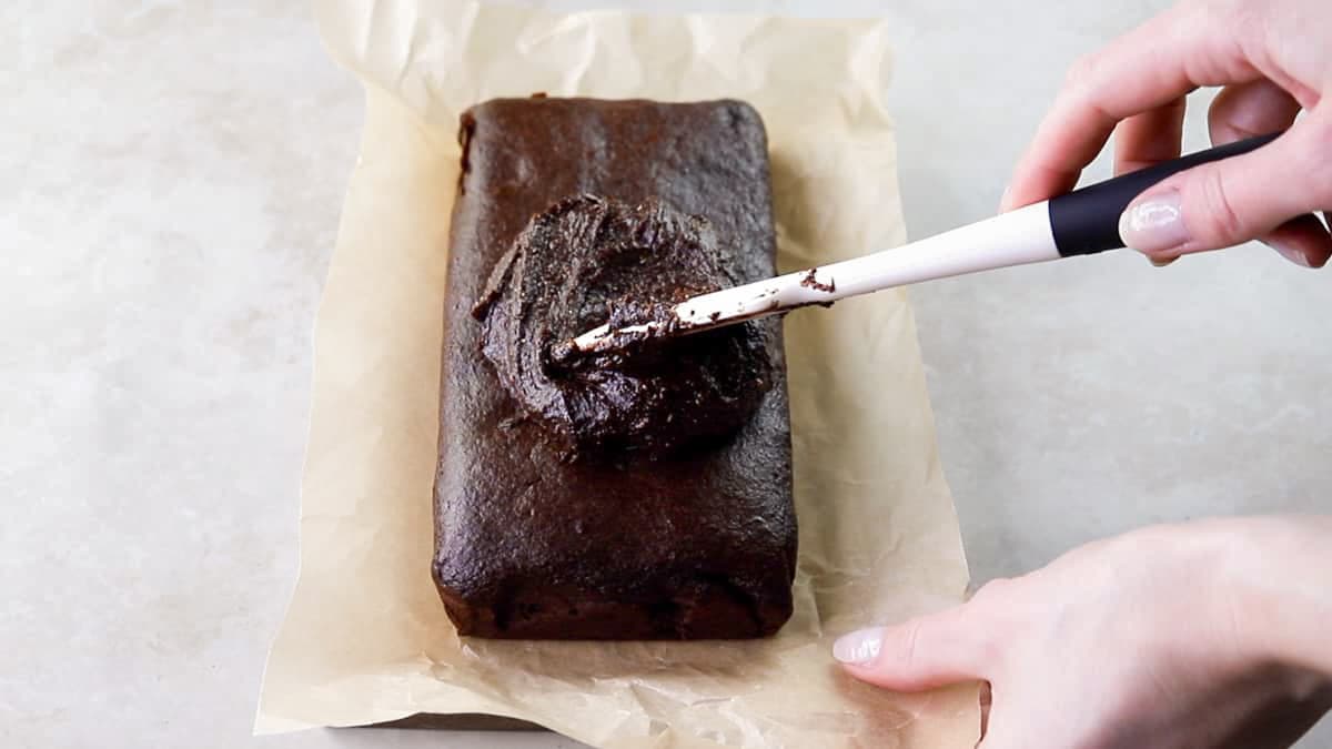 Spread the chocolate frosting over the zucchini brownies