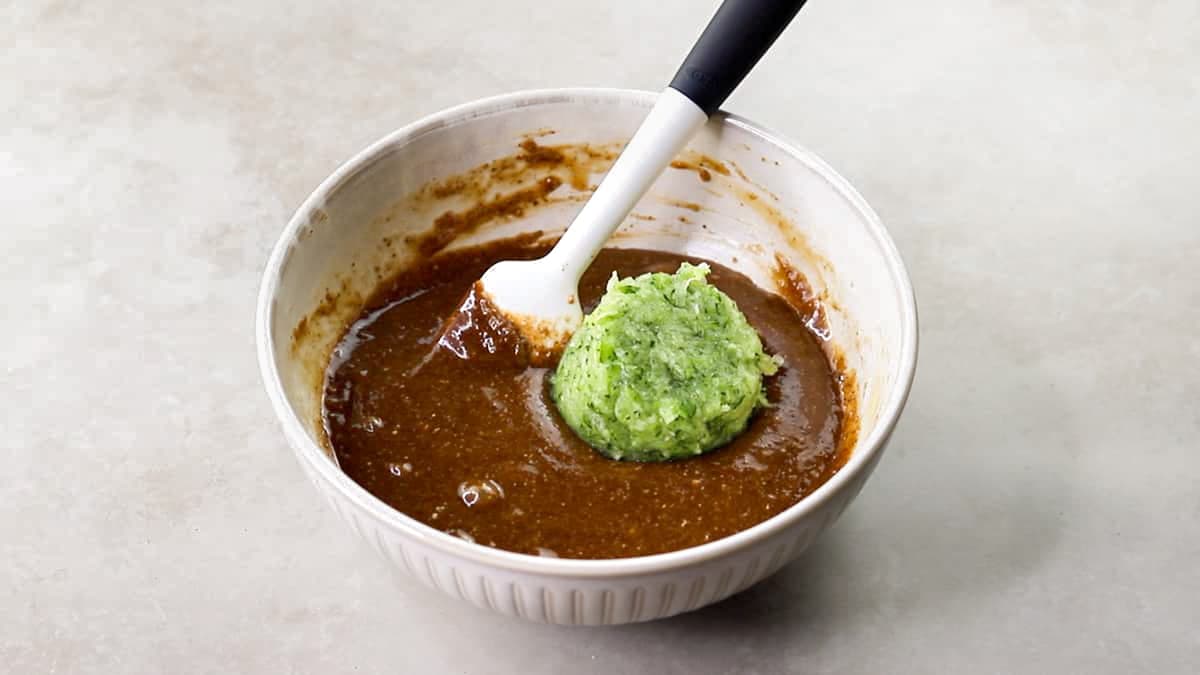 Add the grated and squeezed zucchini to the brownie batter
