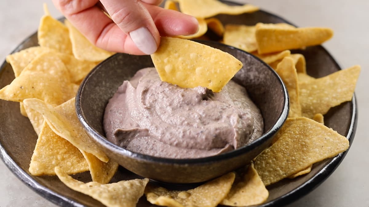 Bowl of black bean dip served with tortilla chips