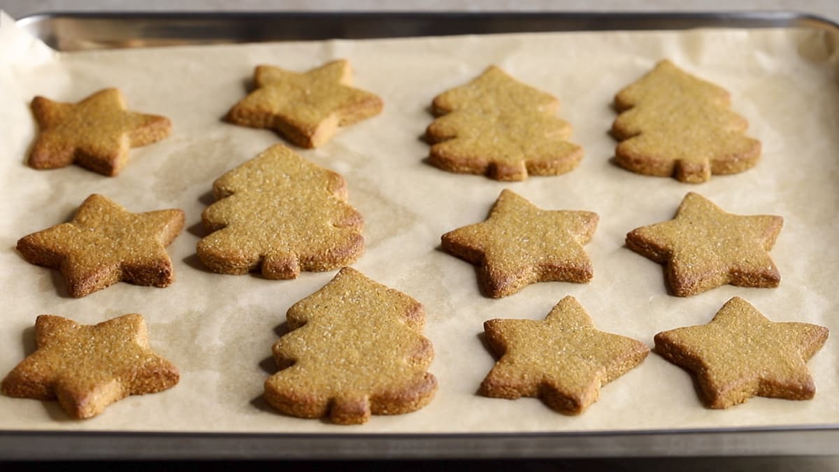 Baked gingerbread cookies shaped like Christmas trees and stars