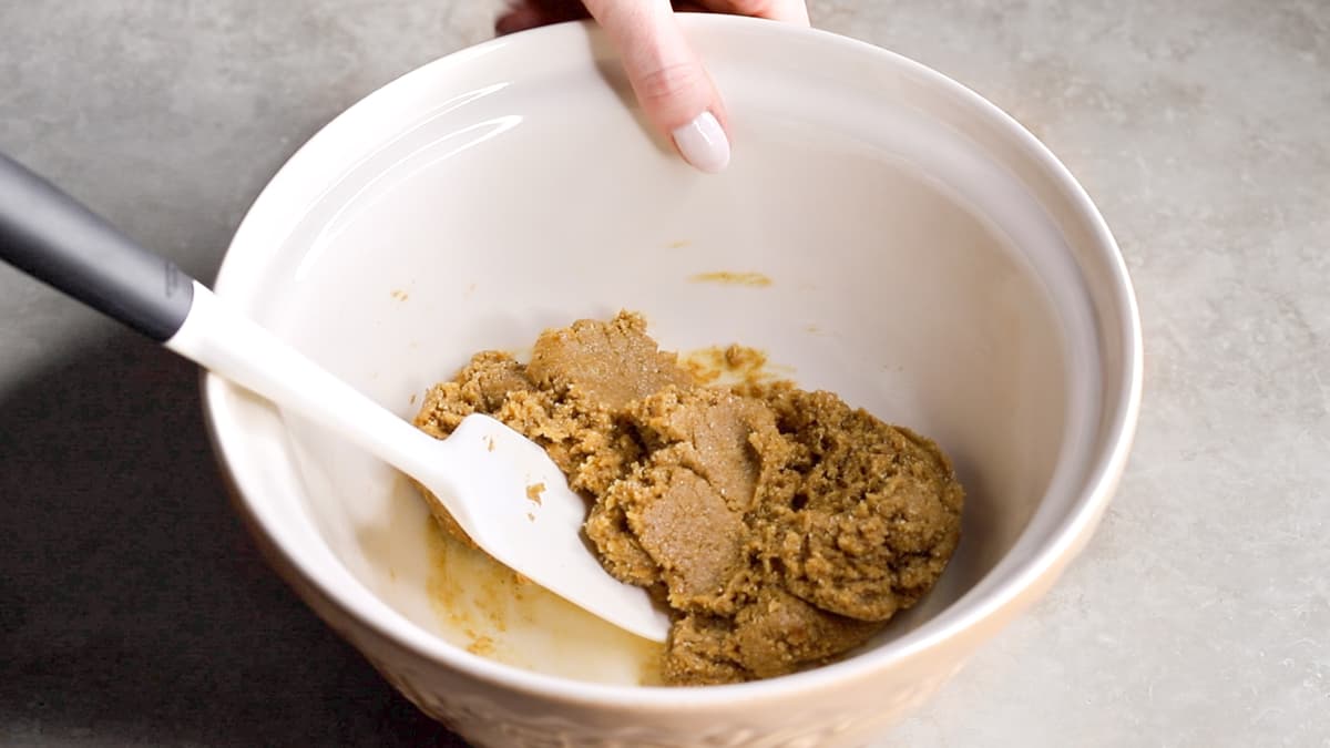 Unbaked gingerbread cookie dough in a mixing bowl