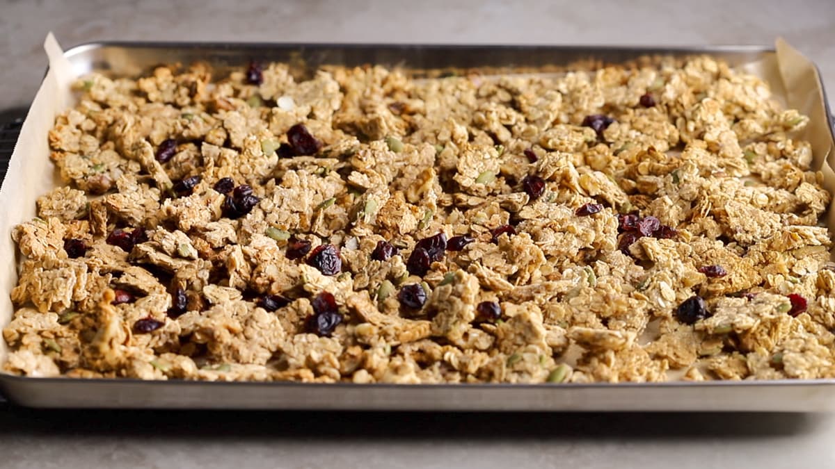 Break the baked granola into clusters and stir through any add-ins