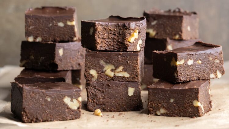 Vegan no-bake brownies stacked on top of each other