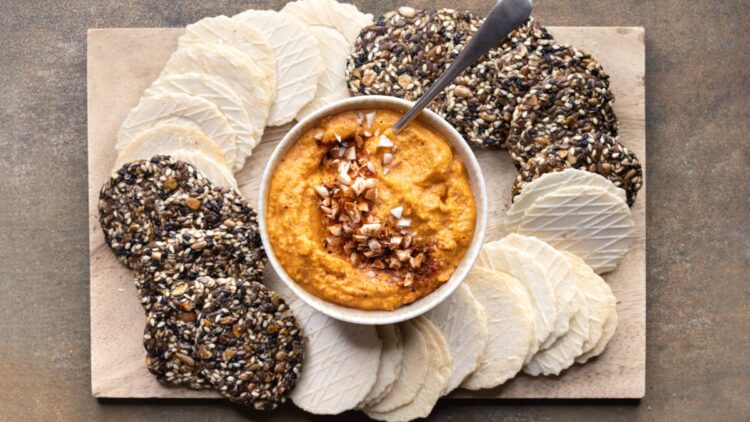 Red pepper dip served with crackers