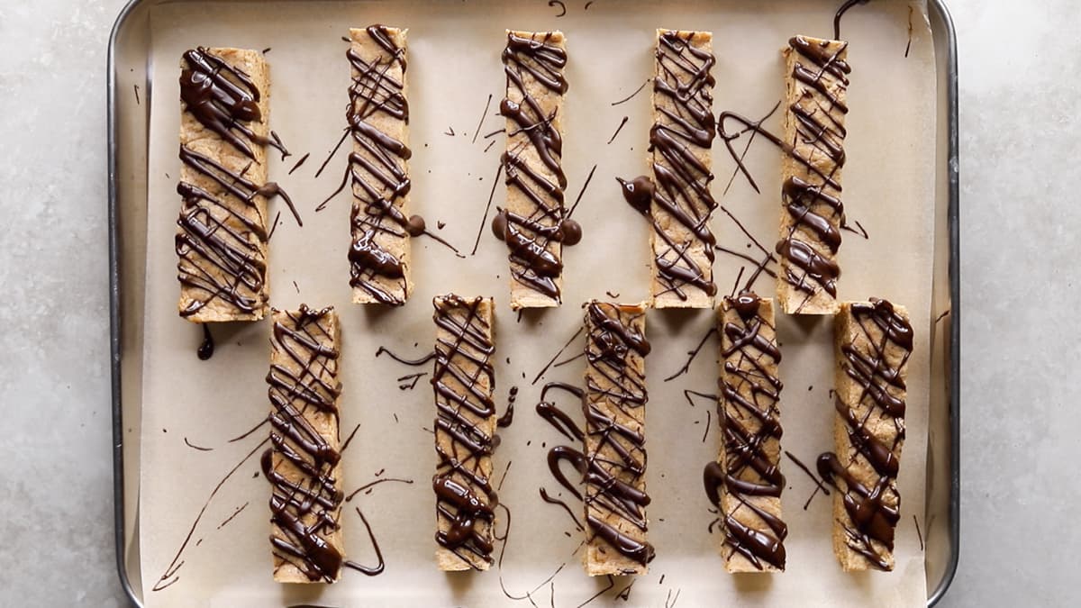 Drizzle the sliced protein bars with melted chocolate