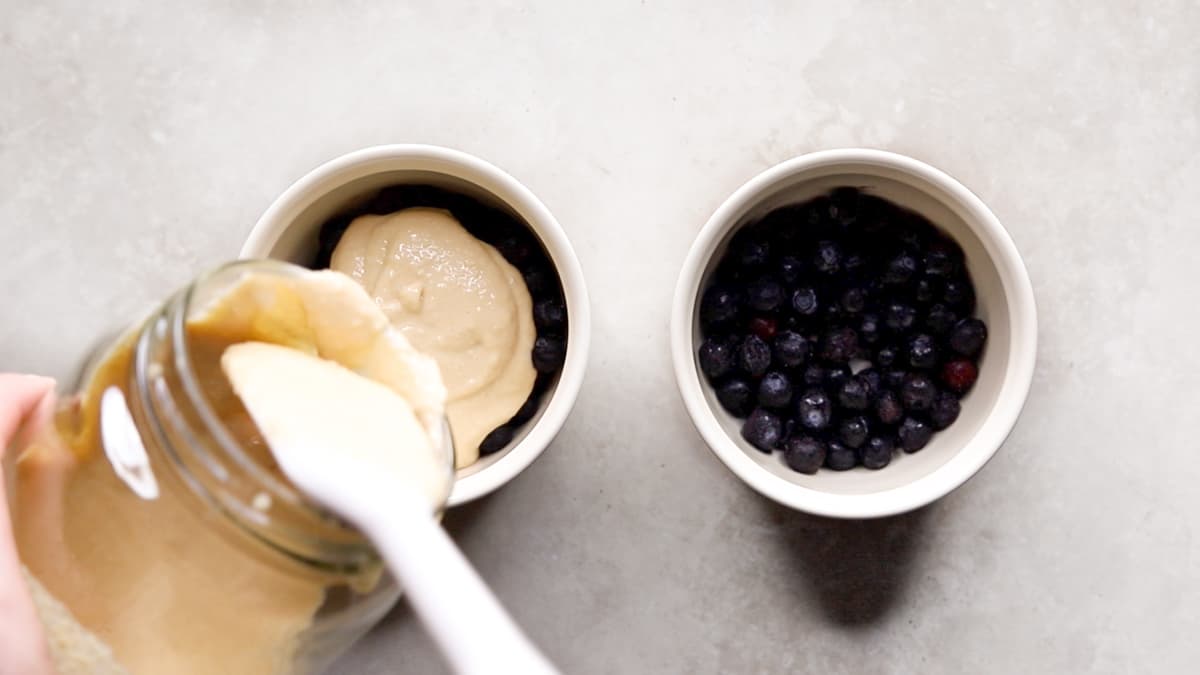 Pour the baked oats mixture oven the frozen blueberries
