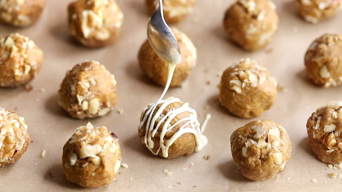 Drizzle the protein balls with melted white chocolate