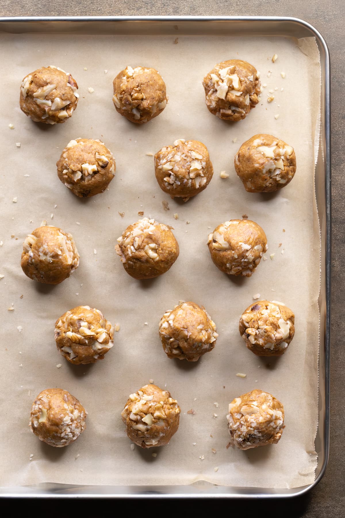 Carrot cake flavored protein balls on a baking tray