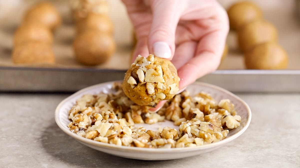 Coat each protein ball in chopped walnuts