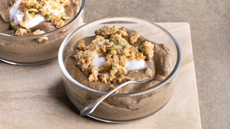 A bowl of blended coffee chia pudding topped with granola