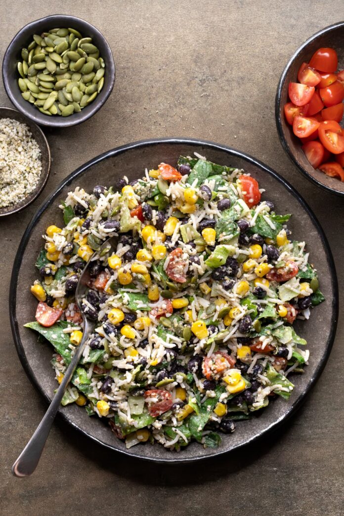 High protein vegan burrito salad with black beans, rice, hemp hearts, and pepitas
