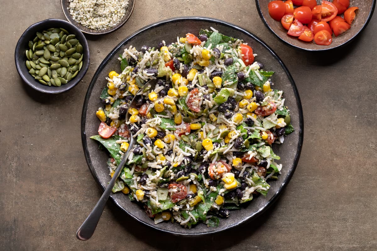 Fully tossed vegan burrito salad served on a plate