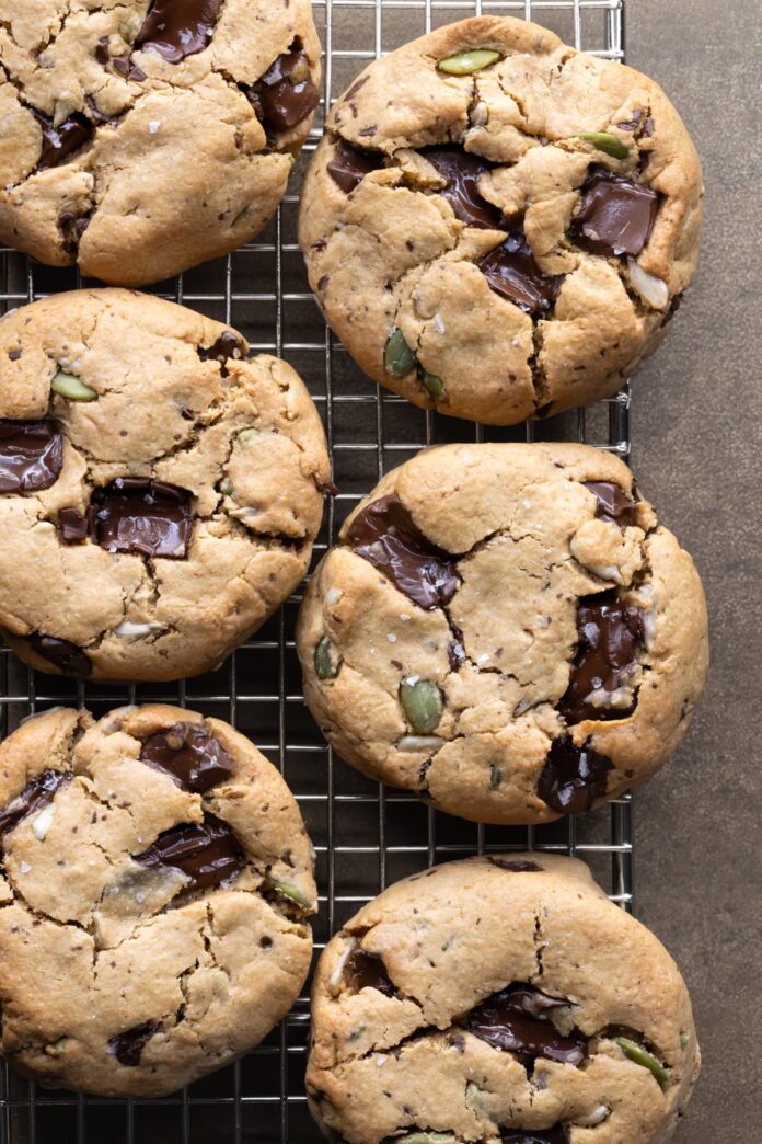 Thick cashew butter chocolate chip cookies on a wire cooking rack