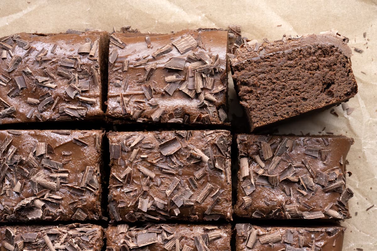 Frosted chickpea chocolate cake cut into squares