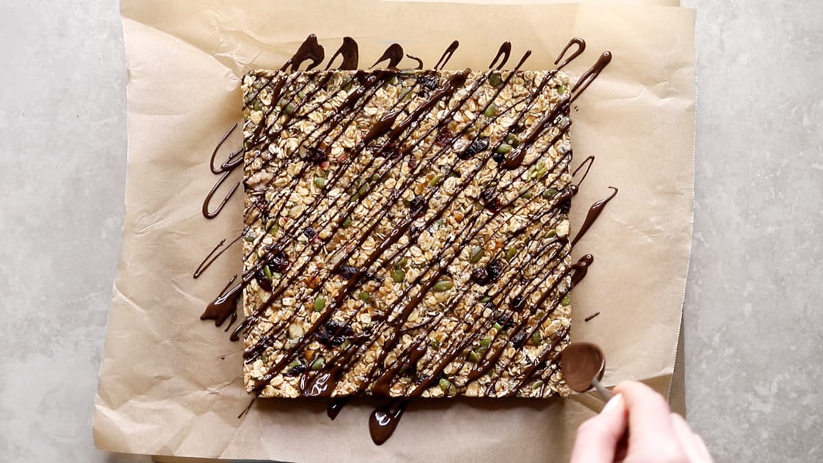 Drizzle the granola bars with melted chocolate