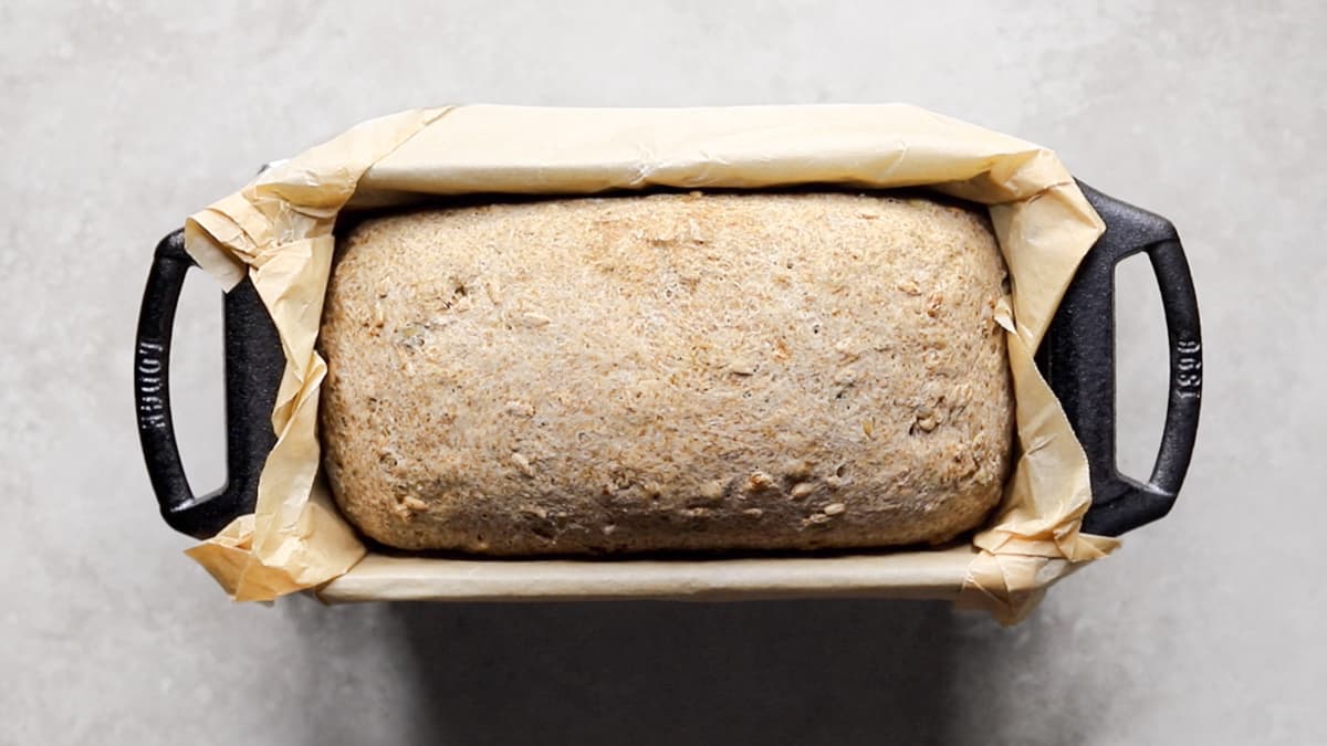 Baked bread in a cast iron loaf pan