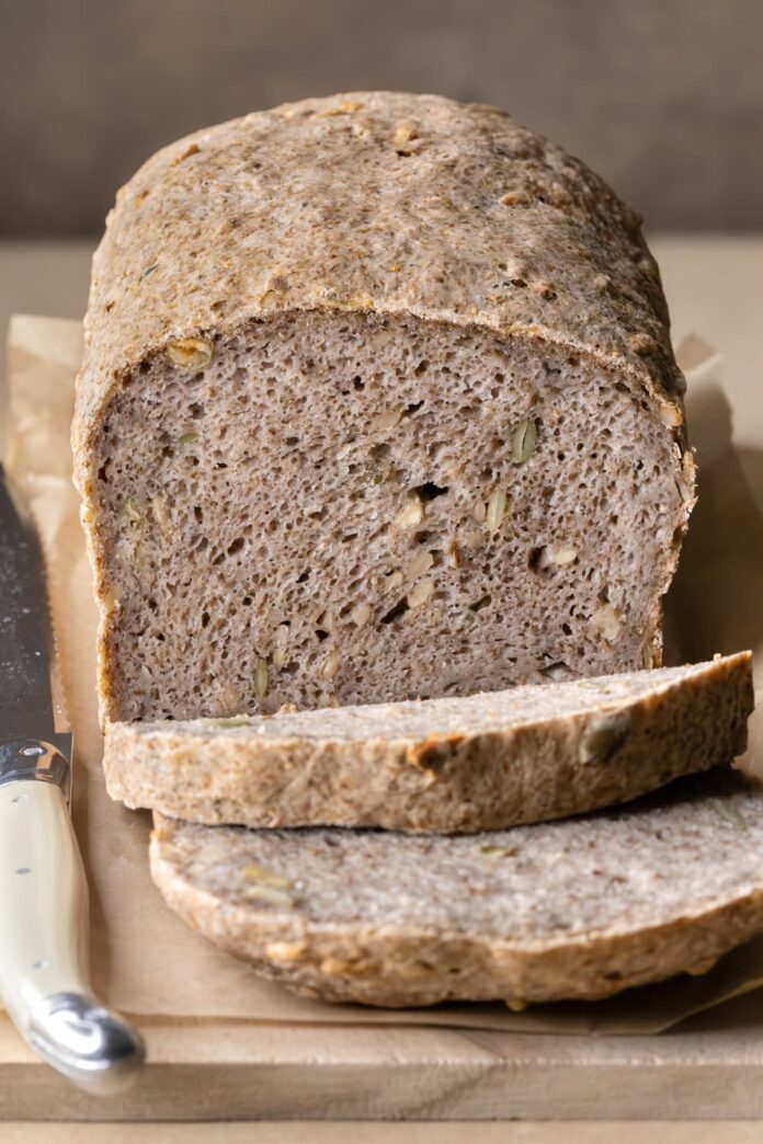 Gluten-free buckwheat bread with chia seeds sliced to show texture