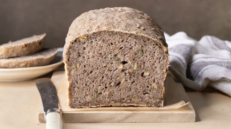 A loaf of gluten-free buckwheat bread with chia seeds