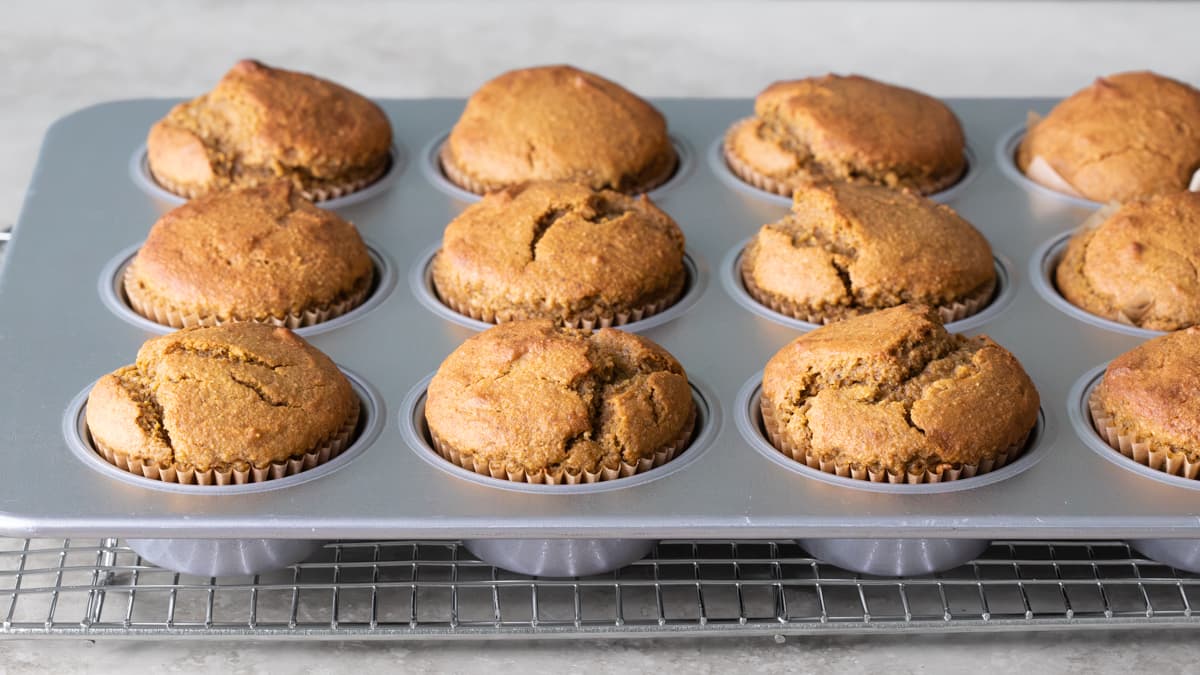 Baked pumpkin oat muffins in a muffin tray