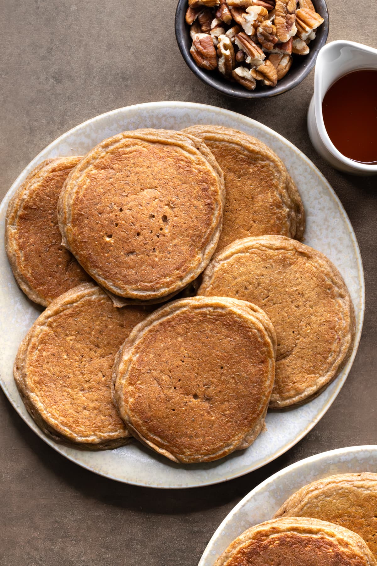 Pancakes arranged in overlapping layers on a plate